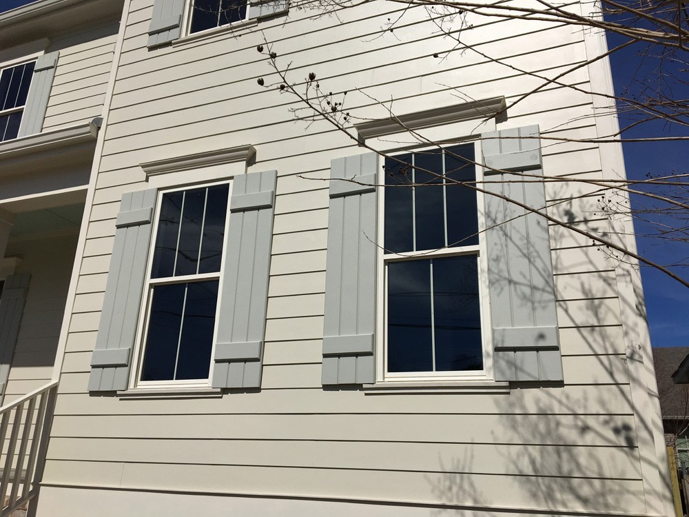 Custom shutters on windows with exterior trim - Strong Shield
